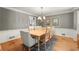A charming dining room features a rustic wood table with a modern chandelier at 2789 Brookcliff Lndg, Marietta, GA 30062