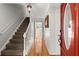 Bright hallway with hardwood floors, staircase, and view into adjacent living spaces at 2789 Brookcliff Lndg, Marietta, GA 30062