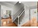 Staircase and open floor plan leading to the living room with hardwood flooring at 2789 Brookcliff Lndg, Marietta, GA 30062