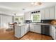 Bright kitchen with white cabinets, stainless steel appliances, and a view into the dining area at 2789 Brookcliff Lndg, Marietta, GA 30062