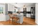 Well-lit kitchen featuring white cabinets, stainless steel appliances, and a breakfast bar at 2789 Brookcliff Lndg, Marietta, GA 30062