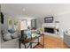 Cozy living room featuring a fireplace, hardwood floors, and comfortable seating at 2789 Brookcliff Lndg, Marietta, GA 30062