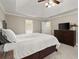 A nicely staged primary bedroom with a large bed and wooden dresser at 2789 Brookcliff Lndg, Marietta, GA 30062