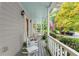 Cozy porch with rocking chairs, views of the neighborhood, and a patriotic American flag at 2789 Brookcliff Lndg, Marietta, GA 30062