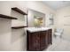 Bathroom featuring a dark wood vanity, modern fixtures, and bright lighting at 4062 Plantation Dr, Marietta, GA 30062