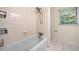 Full bathroom featuring tiled shower and floors and a bright window at 4062 Plantation Dr, Marietta, GA 30062