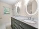 Bathroom with double sink vanity, granite countertop, and tiled floors at 4062 Plantation Dr, Marietta, GA 30062