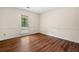 Bedroom with wood laminate flooring with view to the front yard at 4062 Plantation Dr, Marietta, GA 30062