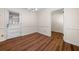 Bright dining room with wood flooring and a white door to the backyard at 4062 Plantation Dr, Marietta, GA 30062