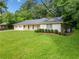 Well-maintained single story home with lush front yard and a convenient side entrance garage at 4062 Plantation Dr, Marietta, GA 30062