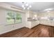Charming kitchen with updated countertops, white cabinets, and a breakfast nook at 4062 Plantation Dr, Marietta, GA 30062