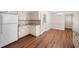 Inviting kitchen with white cabinetry, modern countertops, and wood-look flooring at 4062 Plantation Dr, Marietta, GA 30062