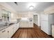 Bright kitchen with ample counter space and white cabinets, perfect for culinary enthusiasts at 4062 Plantation Dr, Marietta, GA 30062