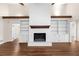 The large living room features a fireplace and built-in bookcases with lots of natural light at 4062 Plantation Dr, Marietta, GA 30062