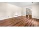 Bright living room showcasing hardwood floors and access to other rooms at 4062 Plantation Dr, Marietta, GA 30062