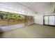 Enclosed patio with brick accents and views of the surrounding greenery at 4062 Plantation Dr, Marietta, GA 30062