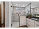 Modern bathroom featuring a glass enclosed shower, with gray-toned tile and a decorative plant on the counter at 48 Old Canton Ne Rd, Cartersville, GA 30121