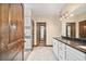 Bright bathroom boasts dual sinks, granite countertops, a walk-in shower, and modern vanity lighting at 48 Old Canton Ne Rd, Cartersville, GA 30121