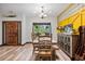 Dining room featuring a wooden dining table set, natural light, and rustic decor elements at 48 Old Canton Ne Rd, Cartersville, GA 30121