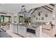 A spacious kitchen featuring a large island with sink, sleek appliances, and rustic decor at 48 Old Canton Ne Rd, Cartersville, GA 30121