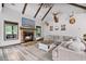 Comfortable living room with a fireplace, vaulted ceilings, and rustic wood beams at 48 Old Canton Ne Rd, Cartersville, GA 30121