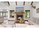 Inviting living room with a stone fireplace, exposed beams, and an open concept layout at 48 Old Canton Ne Rd, Cartersville, GA 30121