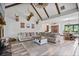 Spacious living area with vaulted ceiling, exposed beams, and rustic decor elements at 48 Old Canton Ne Rd, Cartersville, GA 30121