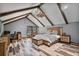 Main bedroom with exposed wood beams, wood grain floors, and wood furniture at 48 Old Canton Ne Rd, Cartersville, GA 30121