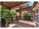 Inviting back deck featuring a striped shade canopy with string lights and black metal railings at 1029 Fairway Ne Ests, Atlanta, GA 30319
