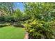 Lush backyard showcasing a well-manicured lawn, vibrant greenery, and a serene outdoor space at 1029 Fairway Ne Ests, Atlanta, GA 30319