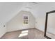 A cozy bedroom with neutral carpet, a window, and a large mirror at 1029 Fairway Ne Ests, Atlanta, GA 30319