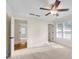 Bright bedroom features neutral carpet, ceiling fan, and two windows, offering a serene space at 1029 Fairway Ne Ests, Atlanta, GA 30319
