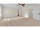 Large bedroom with neutral carpet, ceiling fan, and white trim, offering a serene space at 1029 Fairway Ne Ests, Atlanta, GA 30319