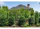 The exterior of this home is surrounded by lush, mature landscaping, offering privacy and natural beauty at 1029 Fairway Ne Ests, Atlanta, GA 30319