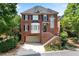 Charming brick home featuring a well-manicured lawn and a two-car garage at 1029 Fairway Ne Ests, Atlanta, GA 30319