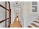 Hallway with hardwood floors, natural light, and a view of the front door at 1029 Fairway Ne Ests, Atlanta, GA 30319
