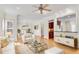 Open living room area with hardwood floors, a ceiling fan, and plenty of natural light at 1029 Fairway Ne Ests, Atlanta, GA 30319