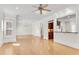 Spacious living room with hardwood floors, natural light, and a kitchen view through breakfast bar at 1029 Fairway Ne Ests, Atlanta, GA 30319