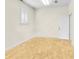 A room with wood flooring, a window with white shutters, white trim, and one door at 1029 Fairway Ne Ests, Atlanta, GA 30319