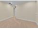 A neutral carpeted room with white trim and baseboards and a view to an adjacent space at 1029 Fairway Ne Ests, Atlanta, GA 30319
