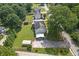 Aerial view showing the house, backyard, and trees at 47 Powder Springs St, Hiram, GA 30141