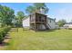 Two-story home featuring a screened porch and well-maintained lawn at 47 Powder Springs St, Hiram, GA 30141