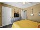 This bedroom offers neutral walls, overhead fan, and guitars as decorations at 47 Powder Springs St, Hiram, GA 30141