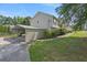 Carport adjacent to a two-story home with a manicured lawn at 47 Powder Springs St, Hiram, GA 30141