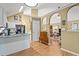 Open kitchen flows into living area with vaulted ceiling and arched entryways at 47 Powder Springs St, Hiram, GA 30141
