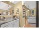 Well-lit kitchen featuring granite countertops, light cabinetry, and open layout at 47 Powder Springs St, Hiram, GA 30141
