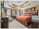 Spacious main bedroom featuring trey ceiling and comfortable furniture at 47 Powder Springs St, Hiram, GA 30141