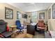 Office space features a large desk, neutral walls, dual monitors and rolling chairs at 47 Powder Springs St, Hiram, GA 30141