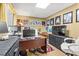 Office space features a large desk, neutral walls, and colorful wall art at 47 Powder Springs St, Hiram, GA 30141