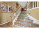 Inviting staircase features decorative tile risers and a wood handrail at 47 Powder Springs St, Hiram, GA 30141